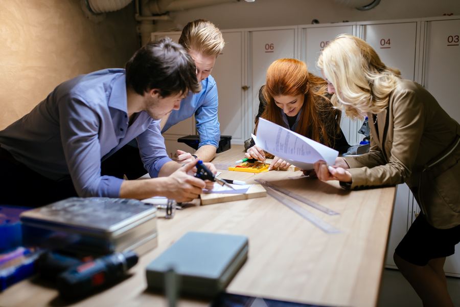 Team gathered around a working document
