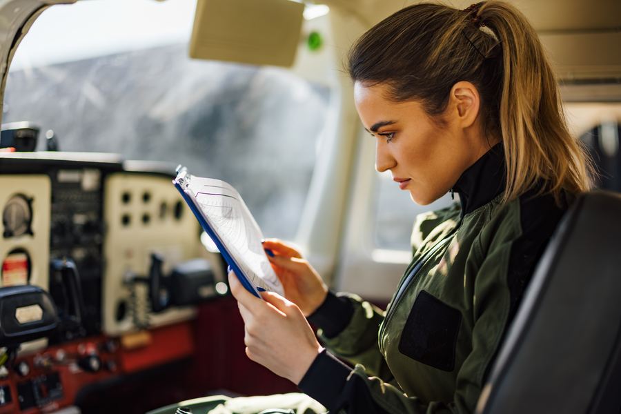 Pilot reviewing flight documentation